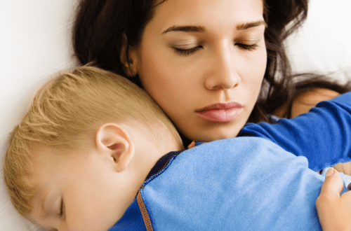 mom snuggling child after tonsillectomy surgery healing cuddle embrace soothing