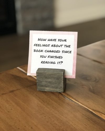 Book Club Discussion Questions for Hostess to display in home for entertaining book club members displayed PDF with questions prompts on wooden display holder